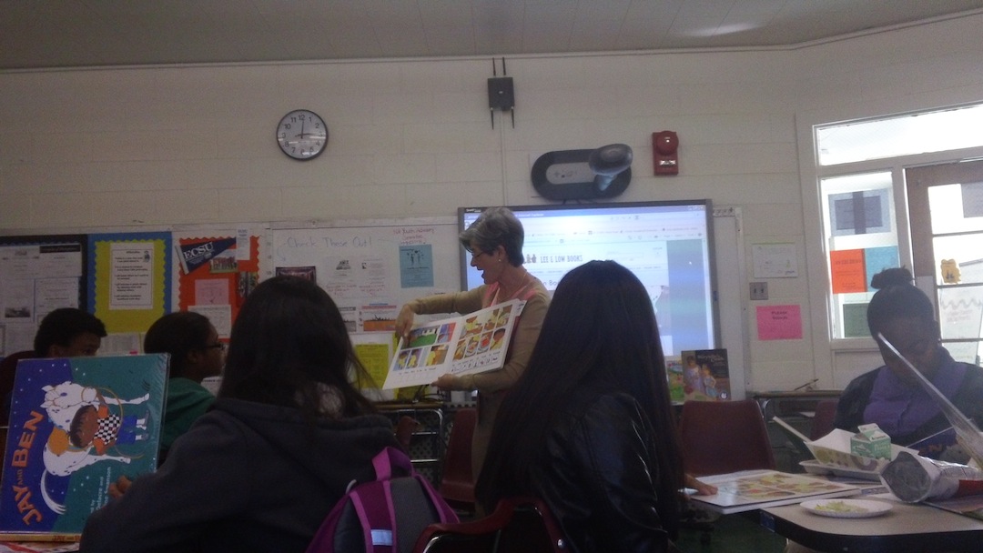 Author Lulu Delacre reads her illustrated book Jay and Ben to participants in the Teen Parent Book Club. 