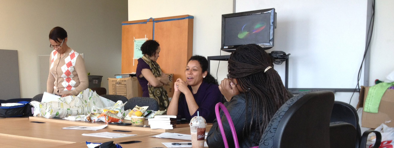 Author Nicole Lynn Lewis (second from right) addressed teen parents during a Teen Parent Book Club meeting.