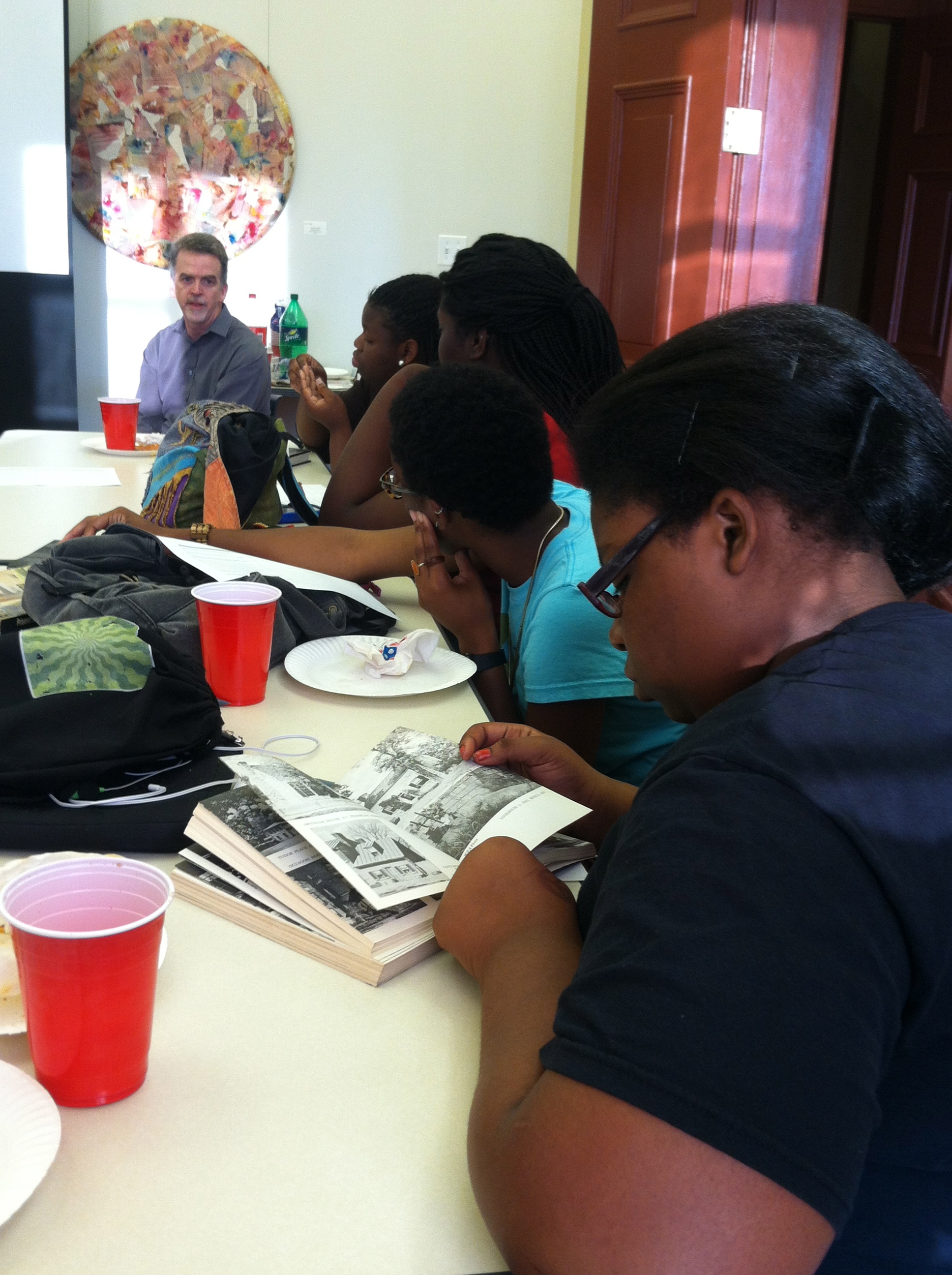 Students examine the WPA Guide to Washington, DC as David A. Taylor talks about the Federal Writers' Project.