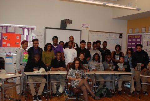 Stewart poses with a class following a visit.