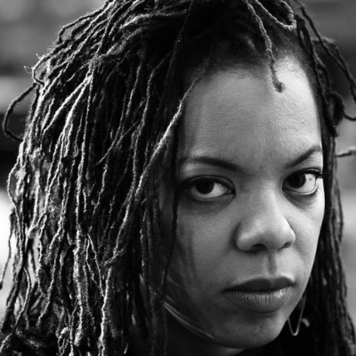 Black and white headshot of writer Airea D. Matthews, a Black woman