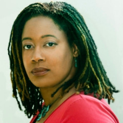 Headshot of author N.K. Jemisin, a Black woman wearing a red top
