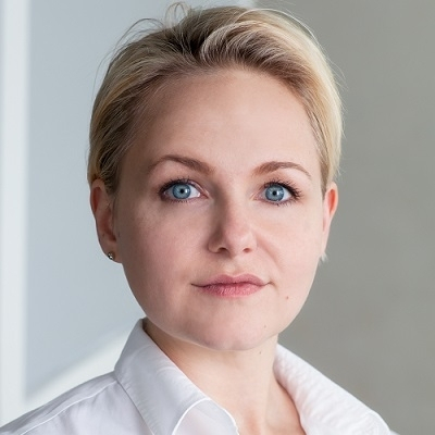 Headshot of Rufi Thorpe, a White woman with blonde hair wearing a white collared top