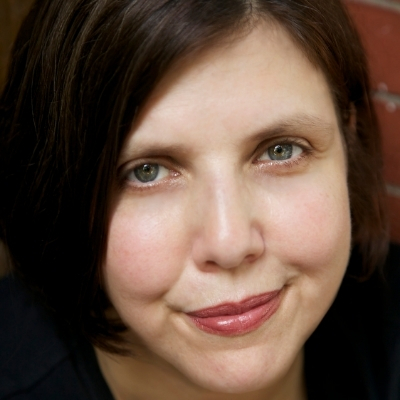 Headshot of author Jenny Offill, a White woman with short brown hair