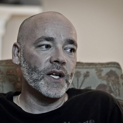 Headshot of Sean Murphy, a White man wearing a black tee