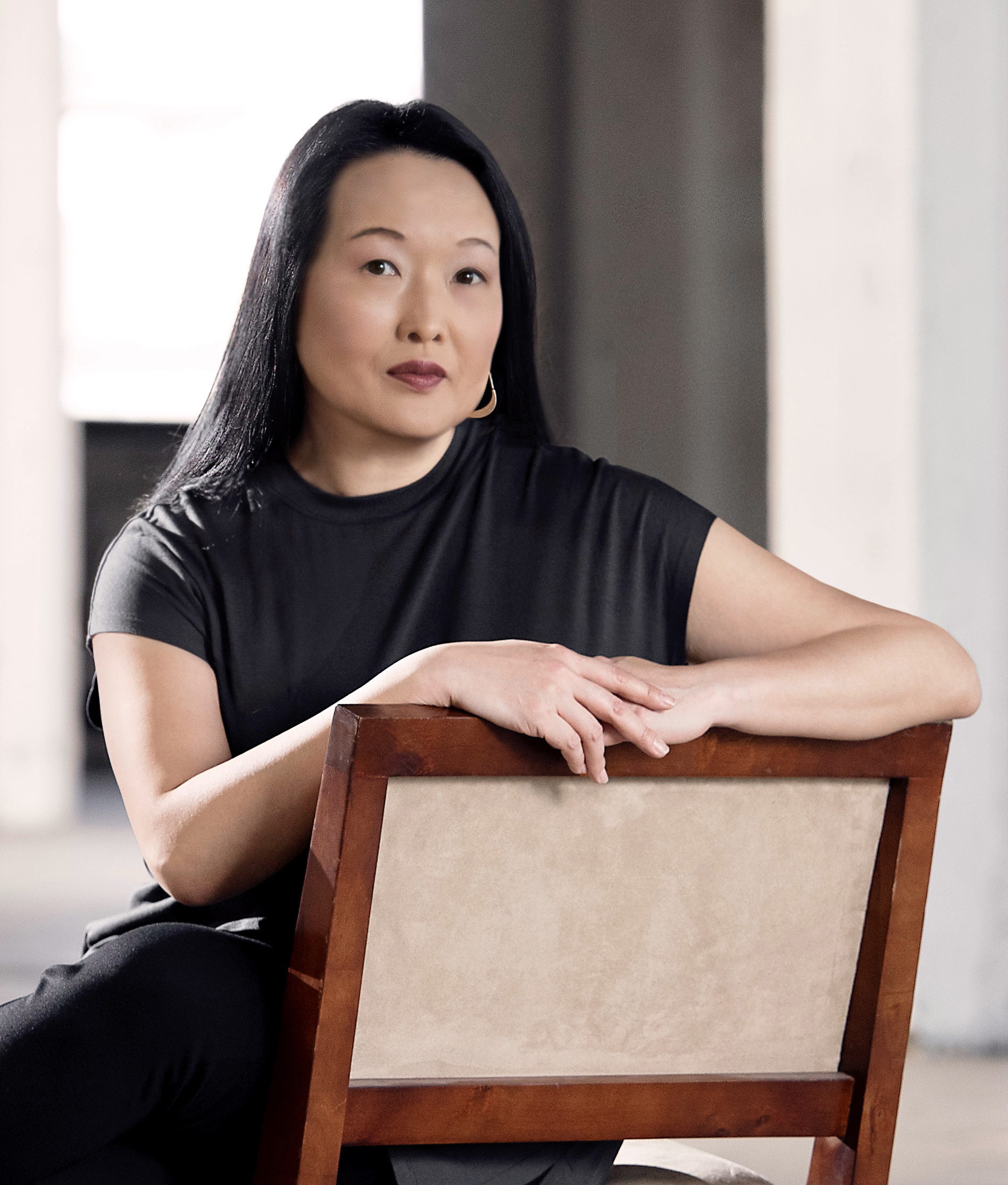 PEN/Faulkner's logo is a dark red circle with a white illustrated feather through the center