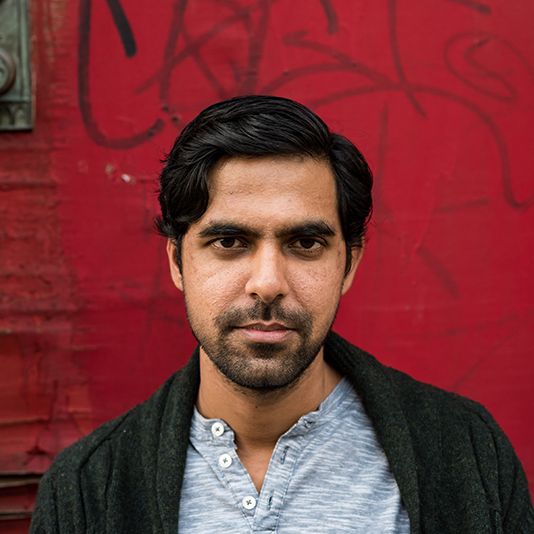 PEN/Faulkner's logo is a dark red circle with a white illustrated feather through the center