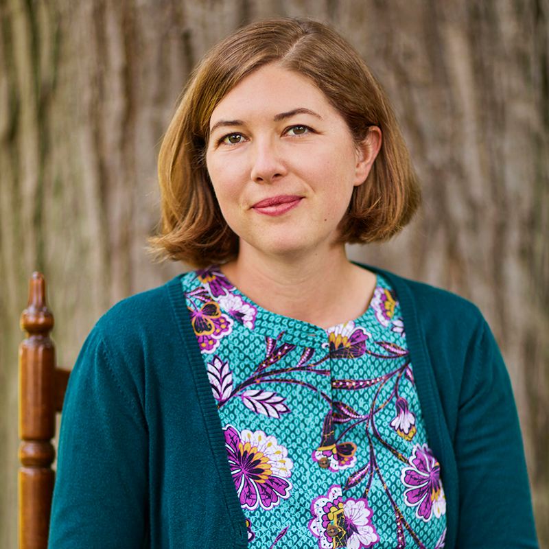 PEN/Faulkner's logo is a dark red circle with a white illustrated feather through the center