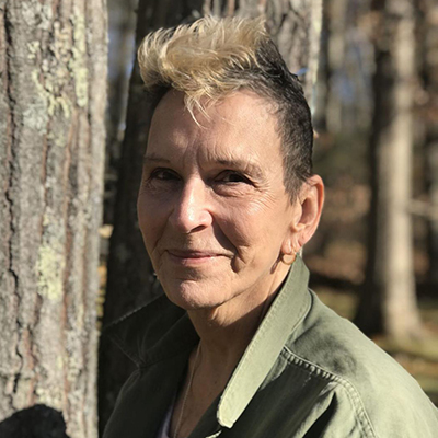 Headshot of author Blanche McCrary Boyd, a White woman wearing a green top