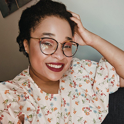 Morgan Jerkins Headshot of Morgan Jerkins, a Black woman with glasses, wearing red lipstick and a floral top