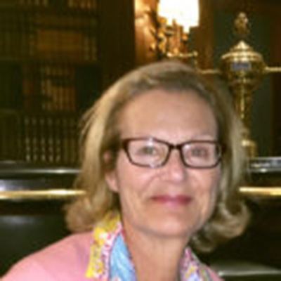 Headshot of Renee K. Gardner, a White woman with short hair and glasses